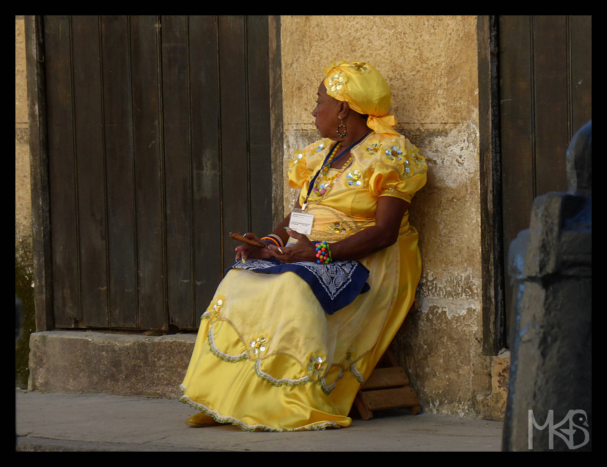 Colorful dressed woman in Havana, Cuba