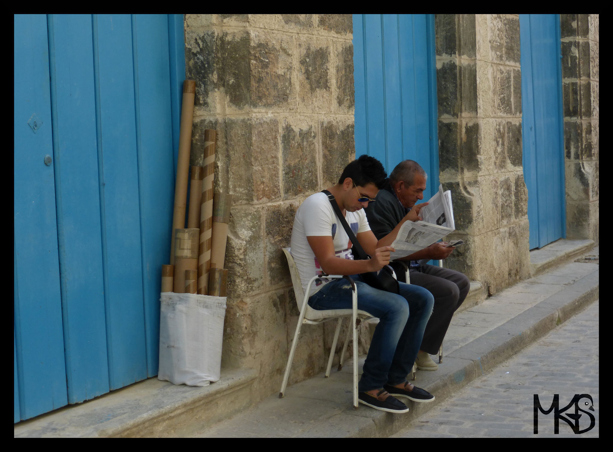 Reading newspapers in Havana, Cuba